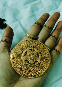 Exquisite Gold Tone Pendant with Intricate Design