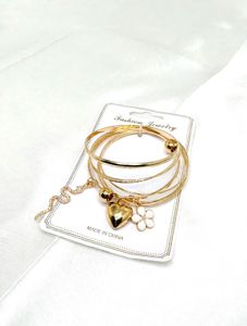 Set of 4 Gold Bangles with Charms