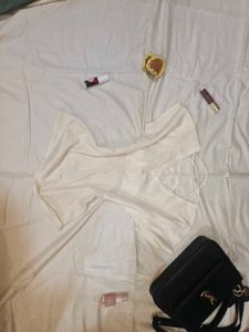 Elegant Cream Top with Cross Back Detail