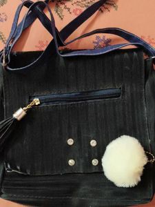 Chic Black Crossbody Bag with Pom Po