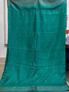 Elegant Teal Saree with Subtle Motifs