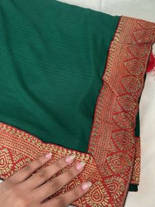 Elegant Green Saree with Red Border