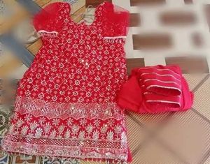Red dress material with embroidery work