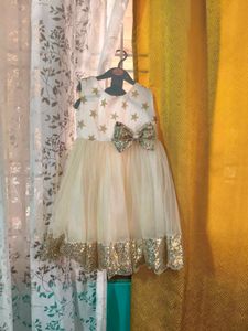 Sparkly Star Dress with Bow. colour is more bright