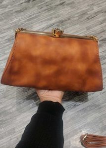 Elegant Brown Clutch with Chain Detail