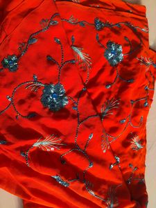 Red Orange Saree With Blue Flower Embroidery