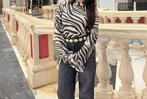 Stylish Zebra Print Bell Sleeve Top with black cam
