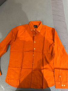 orange shirt from snitch