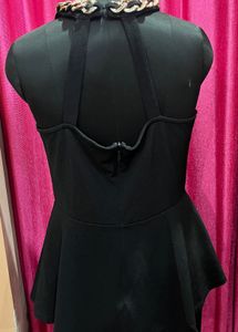 Chic Black Peplum Top with Chain Detail