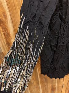 Chic Black Dress with Embellished Sleeves