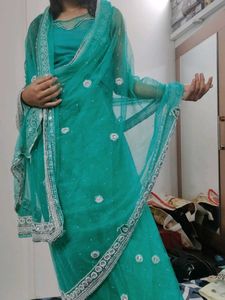 Elegant Teal Saree with Embellishments