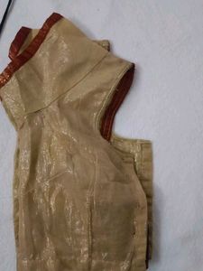 Elegant Gold Blouse with Red Trim