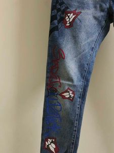 Chrome Hearts cross patch graphic blue jeans