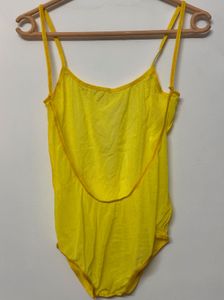 Yellow one-piece swimsuit with a deep scoop back