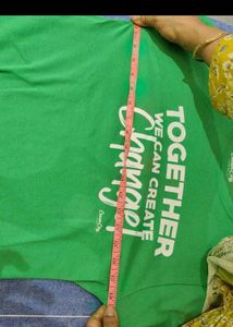 Green Tshirt with Tan shorts