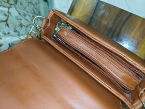 Chic Brown Crossbody Bag with Perforated Design