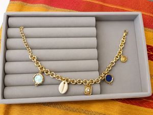 Gold Charm Bracelet with Shells & Stones