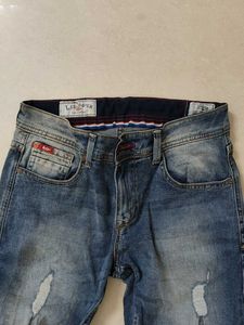 Distressed Blue Denim Jeans