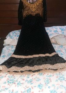 Elegant Black Velvet Gown with Gold Embellishments