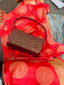 Red Embroidered saree and Blouse with Handbag