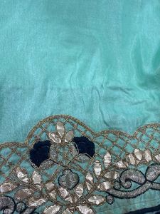 Elegant Teal Saree with Intricate Border