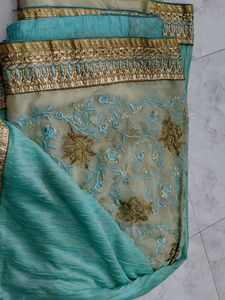 Elegant green Saree with Gold Border