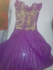 Elegant Purple Gown with Gold Embellishments