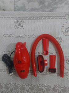 Red hand-held corded electric Vacuum Cleaner
