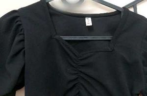 black crop top with bell sleeves