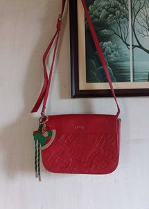 Chic Red Crossbody Bag with Charm