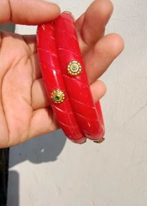 Vibrant Red Bangles with Gold Accents