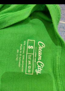 Green Tshirt with Tan shorts
