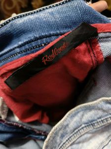 Distressed Light Wash Denim Jeans
