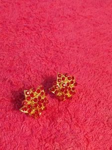 Gold Coloured Studs With Red Stones