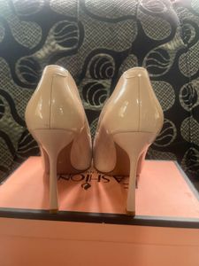 Elegant Nude Patent Bow Pumps