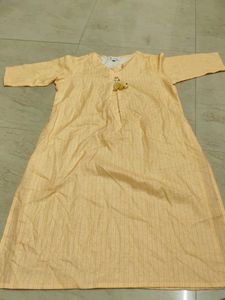 Elegant Yellow Striped Kurta with Tassel Detail