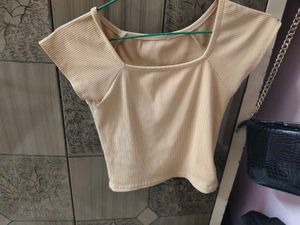beige crop top