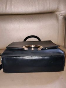 Chic Black Handbag with Gold Accent