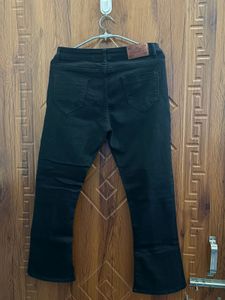 Black Flared Jeans with Grommets