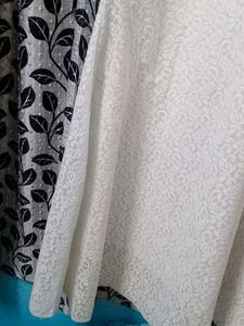 Fish tail gown with round neck.