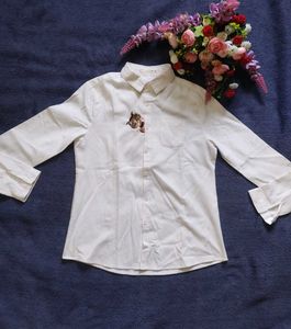 Chic White Button-Up Shirt with Embroidered Detail