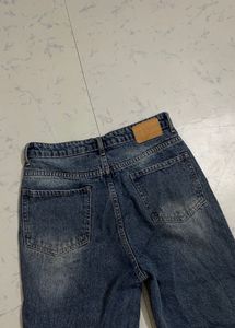 Distressed Blue Denim Jeans
