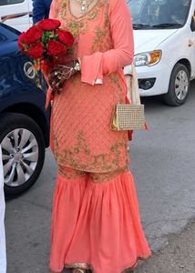 Exquisite Peach Embellished Sharara Set