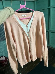 coquette pink sweater sleeve