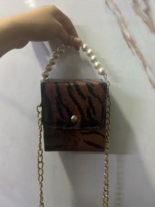 Brown mini clutch