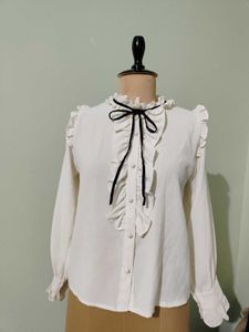 Ruffled White Blouse with Black Bow
