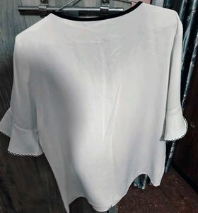 Chic White Blouse with Black Trim