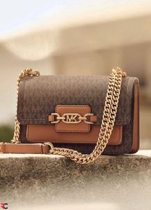 MICHAEL KORS**SIGNATURE LOGO PRINT HEATHER BAG*