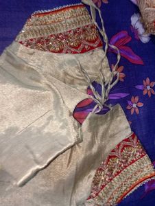 Red Heavy Saree With Golden Blouse.
