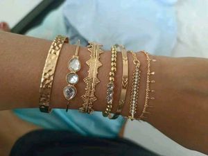 Set of 7 Gold Tone Bracelets